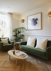 Green sofas and armchair in the Liv Physio waiting area